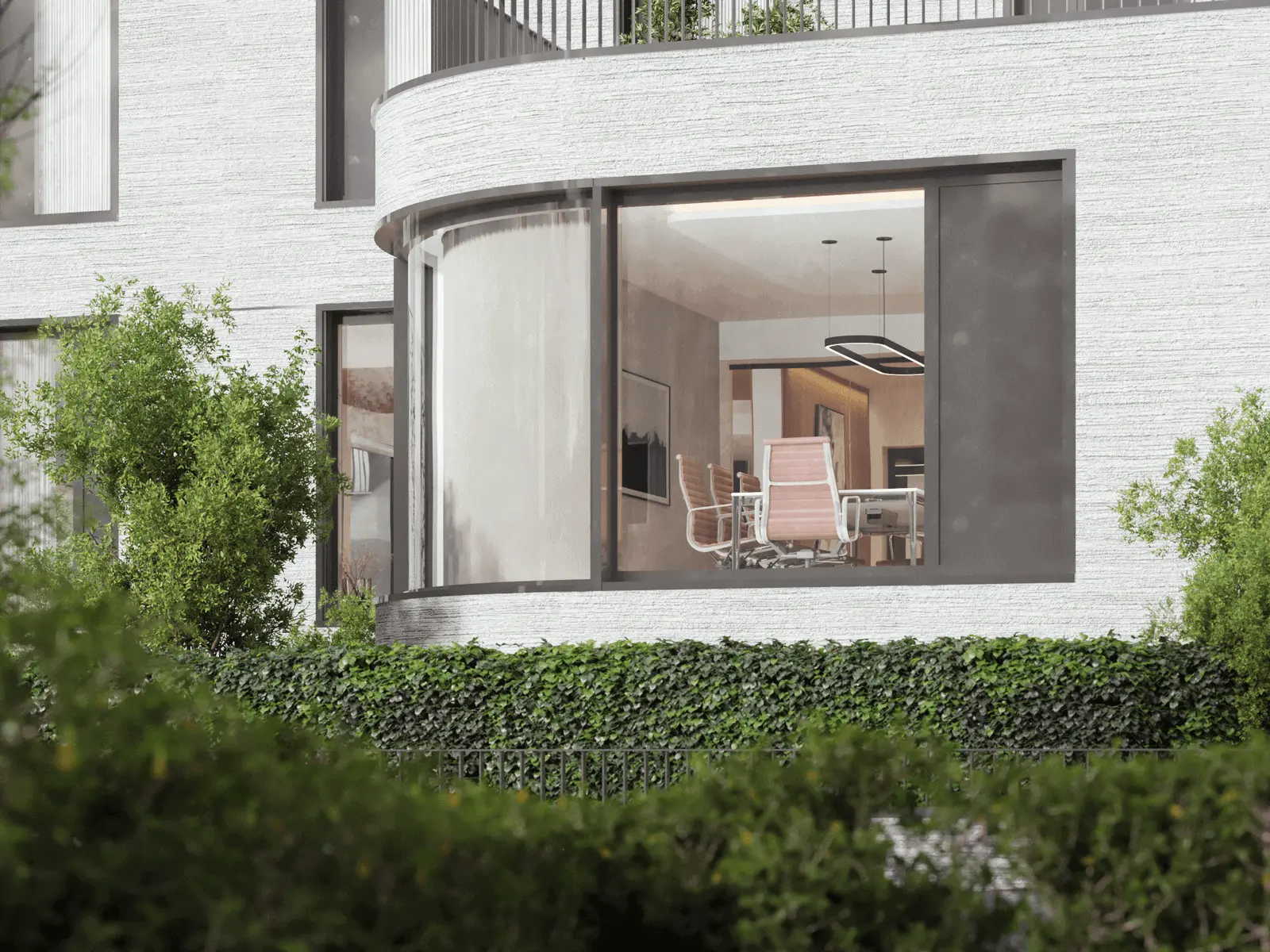 View through a large window into a modern office space with white chairs around a table, contemporary lighting, and greenery outside.