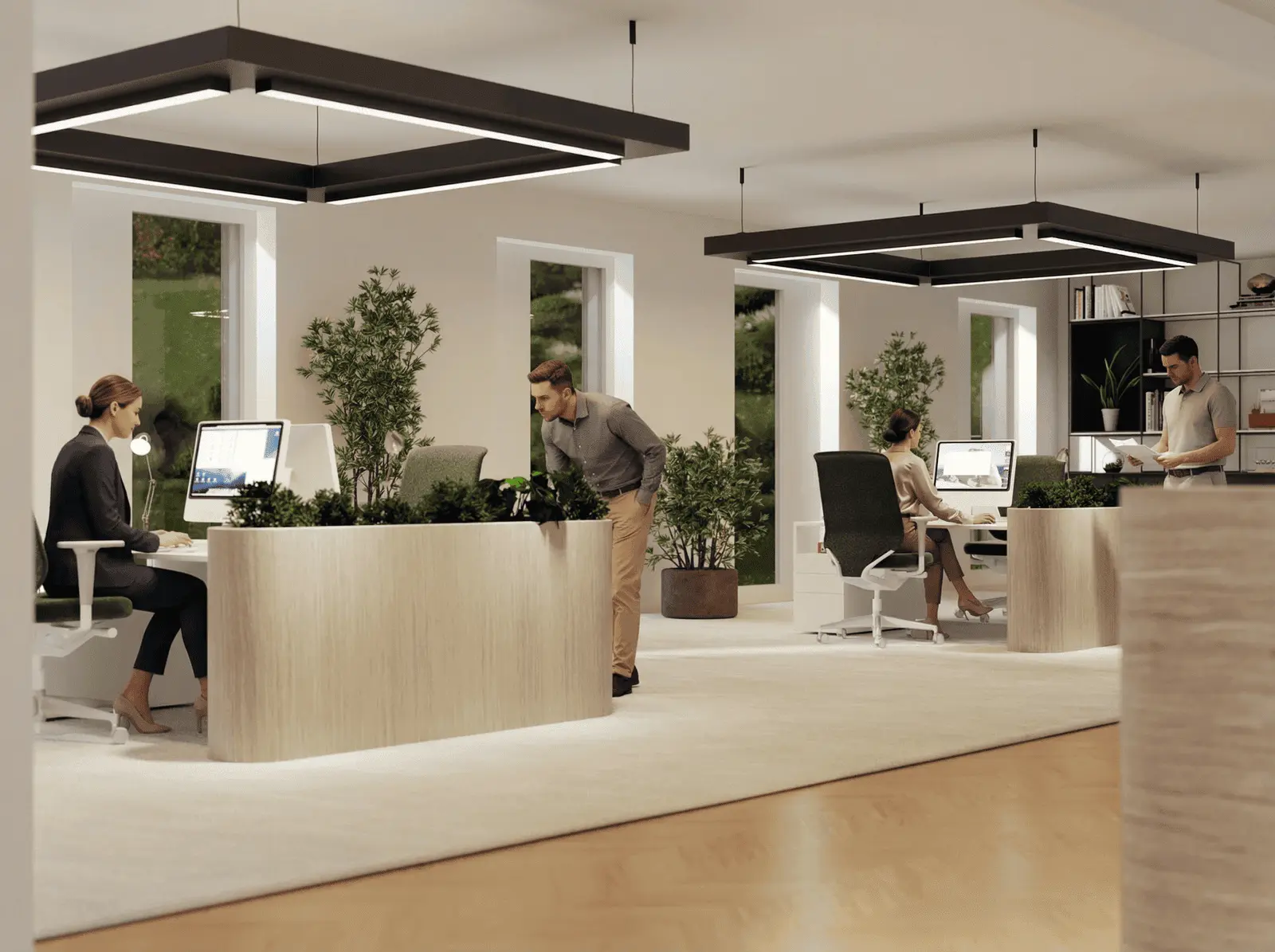 Modern office with four people working at desks, computers on each workstation, large windows, indoor plants, and contemporary lighting.