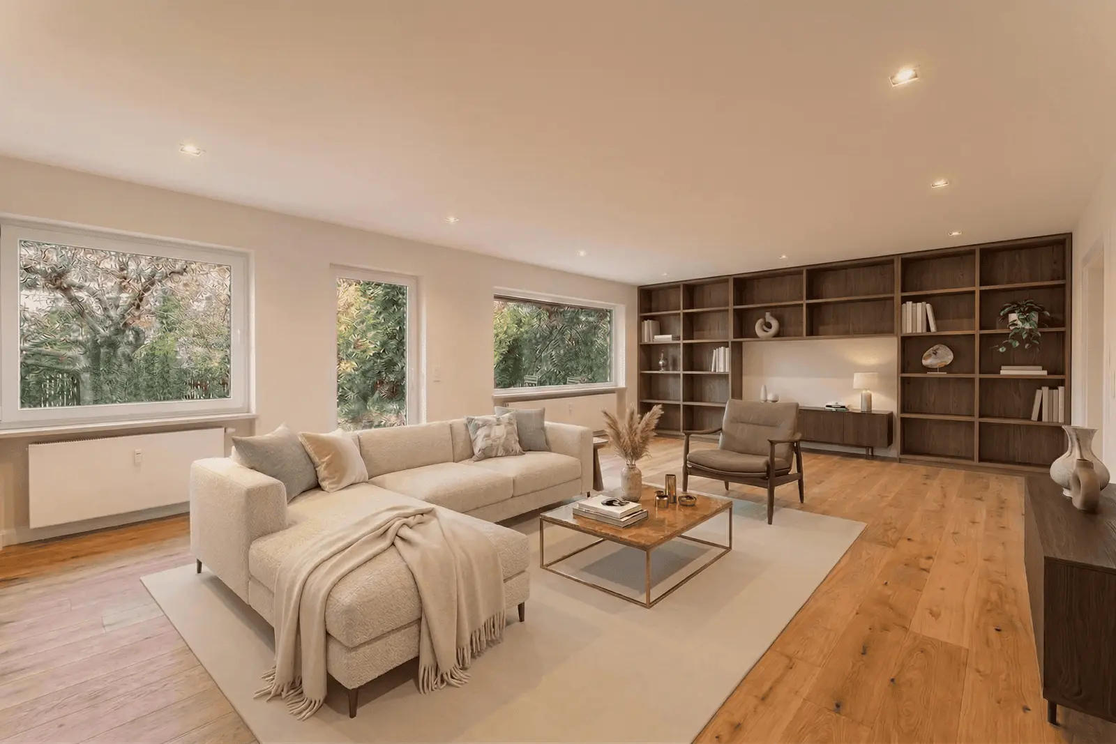 A modern living room with a beige sectional sofa, wooden coffee table, armchair, built-in shelving, large windows, and hardwood flooring.